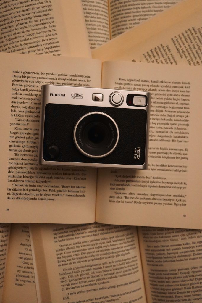 Photo by Leyla  Dalkılıç: https://www.pexels.com/photo/vintage-instant-camera-on-open-books-34637768/

Used by: The Writers for Hire, Inc